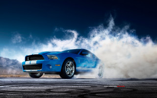 Blue mustang car driving road - smoke free wallpaper for desktop