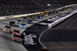 Race cars track crowd stands - a crowd watching free wallpaper