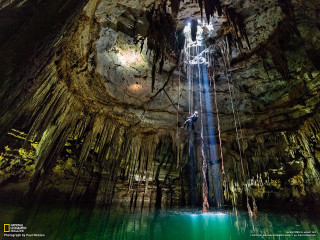 Man suspended rope cave waterfall - amazing free wallpaper