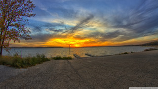 Sunset water tree fence foreground - a tree in the foreground free wallpaper