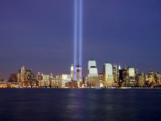 City skyline light beams water - a body of water free wallpaper for desktop