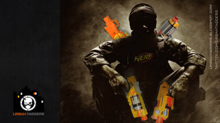 Man black uniform holding guns - splash art free wallpaper