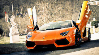 Orange sports car parked street 3 - nice free wallpaper