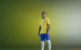 Man yellow shirt blue shorts - a soccer ball free wallpaper