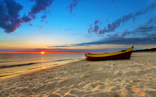 Boat beach sunset clouds ocean - sandy free wallpaper