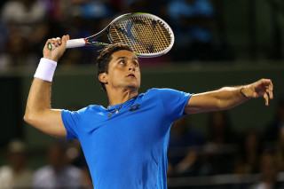 Man holding tennis racquet court 4 - the stand free wallpaper