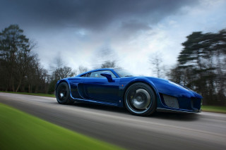 Blue sports car driving cloudy 3 - a dark cloud free wallpaper
