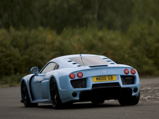 Blue sports car driving road - a forest of trees and bushes free wallpaper