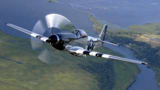 Propeller plane green field river - a propeller plane free wallpaper