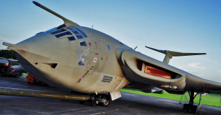 Airplane tarmac grass trees sky - side profile free wallpaper