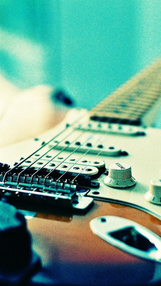Guitar closeup hand holding neck - a close up of a guitar free wallpaper