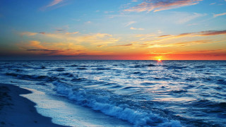 Sunset ocean waves boat distance 2 - a sunset over the ocean free wallpaper