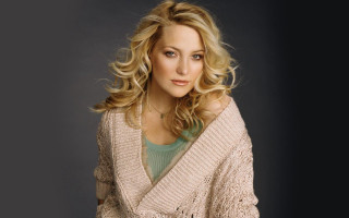 Blonde woman sweater jeans casual - a picture in a studio setting free wallpaper