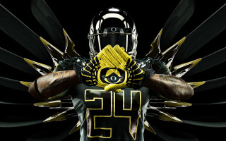 Football player yellow black uniform 2 - a football player free wallpaper