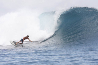 Man riding wave surfboard ocean 22 - top of a surfboard in the ocean free wallpaper