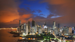 City skyline night cloudy water - a body of water below free wallpaper