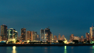 City skyline night water background 2 - a city skyline in the background free wallpaper