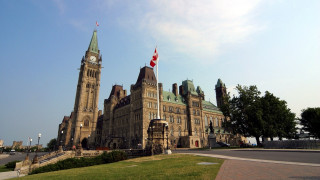 Large building clock tower flag - side and a flag free wallpaper