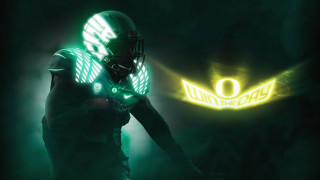 Football player green uniform neon 2 - a football player free wallpaper