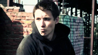 Man black hoodie brick wall - a brick wall free wallpaper