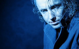 Man curly hair blue shirt - constructivism free wallpaper