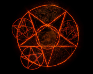 Glowing orange circle star black - a star in the middle of it free wallpaper