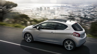 Silver car city skyline lake - a silver car free wallpaper