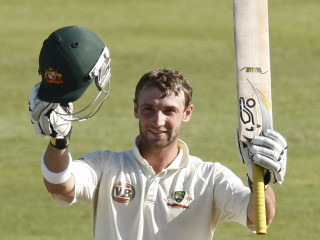 Man holding bat helmet grass - his hand and a helmet free wallpaper