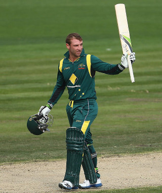 Man batting green uniform outdoors - australian tonalism free wallpaper