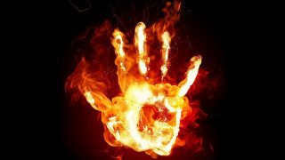 Hand flames black background red - the middle of it free wallpaper