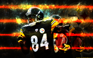 Football player holding ball helmet 4 - a football player holding free wallpaper