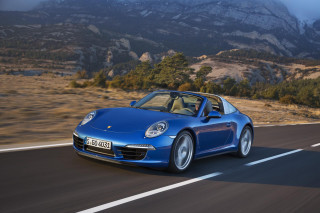 Blue porsche mountain road cloudy - a mountain range in the background free wallpaper
