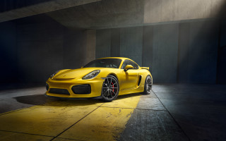 Yellow porsche parking garage spotlight - a concrete wall free wallpaper