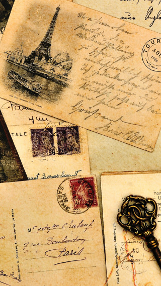 Old postcards with key attached - a key free wallpaper