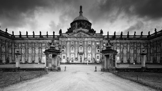 Large building gate cloudy sky - a dirt road free wallpaper