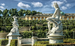 Statue woman bench garden building - a statue of a woman free wallpaper
