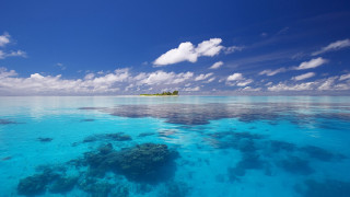 Blue ocean island clouds sky - a blue ocean free wallpaper
