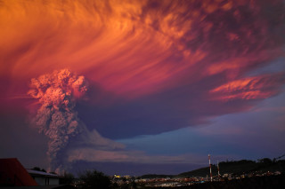 Volcano smoke steam night city - free new year wallpaper