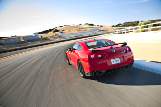 Red sports car road hill 2 - a fence free wallpaper
