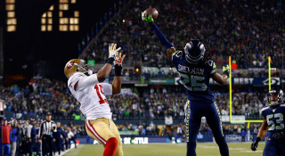 Football player catching ball cityscape - a ball in the air free wallpaper