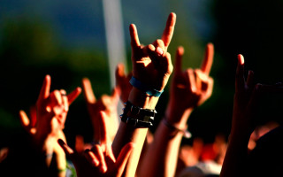 Group people raising hands metal - their hands in free wallpaper