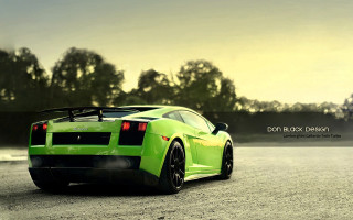 Green sports car parked road 2 - a green sports car free wallpaper