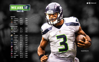Football player holding ball scoreboard - a football player holding free wallpaper
