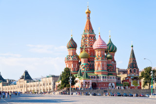 Large building spires people walking - constructivism free wallpaper