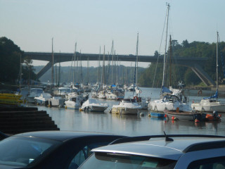 Boats parked water bridge over - de hirsh margule free wallpaper