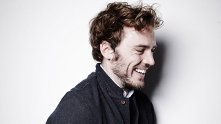 Man beard smiling sweater tie - a white wall behind free wallpaper