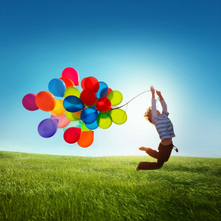 Person jumping balloons blue sky 4 - cheerful free wallpaper