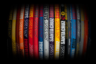 Colored baseball bats black background - colored free wallpaper