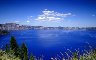 Lake mountains trees sunny sky - a large body of water free wallpaper