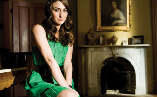 Woman green dress piano fireplace - a fireplace free wallpaper